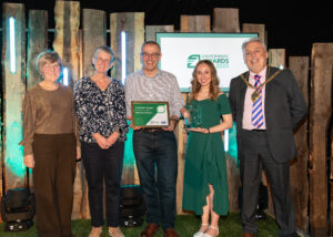 Photograph of the Beach Care Volunteers receive their award for Environmental Community Action.